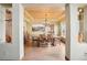 Formal dining room with a decorative tin ceiling, hardwood floors, and large picture window at 8131 S Coolidge Way, Aurora, CO 80016