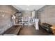 Finished basement features a gym with treadmill, workout station, weights, and rubber floor mats at 8131 S Coolidge Way, Aurora, CO 80016