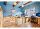 Spacious home office features custom wood desk, exposed beams, and ample natural light at 8131 S Coolidge Way, Aurora, CO 80016