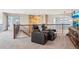 Upstairs theater area features reclining seating, railing overlook, and views from the staircase at 8131 S Coolidge Way, Aurora, CO 80016
