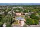 Aerial view of a neighborhood featuring a ranch-style home with a well-kept yard and mature trees at 2125 Rangeview Ln, Longmont, CO 80501