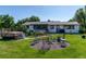Spacious backyard with a gravel fire pit area and hot tub, perfect for outdoor entertaining at 2125 Rangeview Ln, Longmont, CO 80501