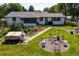 Overhead shot of an inviting backyard with a hot tub, fire pit area, and lush landscaping at 2125 Rangeview Ln, Longmont, CO 80501