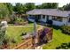 Charming backyard featuring lush landscaping, a patio, and a tranquil garden area at 2125 Rangeview Ln, Longmont, CO 80501