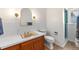 Well-lit bathroom features a vanity with storage, a large mirror, and a tiled shower at 2125 Rangeview Ln, Longmont, CO 80501