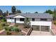 Charming ranch-style home with a landscaped front yard, and a two-car garage at 2125 Rangeview Ln, Longmont, CO 80501