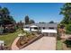 Exterior of a home with a well-manicured front yard and driveway at 2125 Rangeview Ln, Longmont, CO 80501