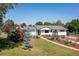 Exterior of a house featuring a well-maintained lawn and mature trees at 2125 Rangeview Ln, Longmont, CO 80501
