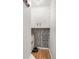 Hallway closet with unique floral wallpaper, built in shelving, and plenty of storage at 2125 Rangeview Ln, Longmont, CO 80501
