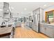 Spacious kitchen with stainless steel appliances, white countertops, and seamless flow to the living area at 2125 Rangeview Ln, Longmont, CO 80501