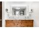 Modern bathroom featuring double sinks, a granite countertop, and sleek fixtures at 1551 Larimer St # 1405, Denver, CO 80202