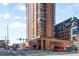 Exterior shot of a high-rise building with brick facade and multiple balconies at 1551 Larimer St # 1405, Denver, CO 80202