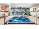 Indoor hot tub with tiled walls and a view into the fitness center at 1551 Larimer St # 1405, Denver, CO 80202