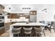 Modern kitchen with custom cabinets, a large island, and stainless steel appliances at 1551 Larimer St # 1405, Denver, CO 80202