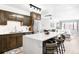 Bright kitchen features an island with bar seating and a view of the living area at 1551 Larimer St # 1405, Denver, CO 80202