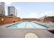 Rooftop pool area with lounge chairs and views of the city skyline at 1551 Larimer St # 1405, Denver, CO 80202