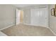 Neutral bedroom with light carpet features a double door closet at 13353 Amber Sky St, Parker, CO 80134