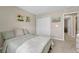 Bedroom featuring neutral tones, plush carpet, a closet with white doors at 13353 Amber Sky St, Parker, CO 80134