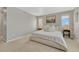 Bright bedroom featuring neutral tones, plush carpet, and a king-size bed with soft, inviting bedding at 13353 Amber Sky St, Parker, CO 80134