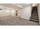 Spacious finished basement with soft carpet and easy access to stairs at 5304 Granby St, Denver, CO 80239