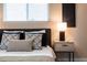 Comfortable bedroom with soft lighting, stylish decor, and a cozy bed at 5304 Granby St, Denver, CO 80239