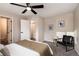 Bedroom featuring neutral decor, ceiling fan, and cozy furniture at 5304 Granby St, Denver, CO 80239