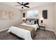 Bedroom featuring neutral decor, ceiling fan and window at 5304 Granby St, Denver, CO 80239
