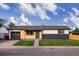 Charming single-story home featuring a combination of wood and brick exterior, complemented by a well-manicured lawn at 5304 Granby St, Denver, CO 80239