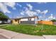 Charming single-story home featuring a combination of wood and brick exterior, complemented by a well-manicured lawn at 5304 Granby St, Denver, CO 80239