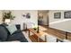 Comfortable living room with modern furniture, neutral color scheme, and wood flooring at 5304 Granby St, Denver, CO 80239