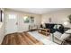 Comfortable living room with modern furniture, neutral color scheme, and wood flooring at 5304 Granby St, Denver, CO 80239