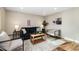 Comfortable living room with modern furniture, neutral color scheme, and wood flooring at 5304 Granby St, Denver, CO 80239