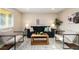 Comfortable living room with modern furniture, neutral color scheme, and wood flooring at 5304 Granby St, Denver, CO 80239