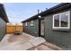 Private patio area featuring newly painted brick exterior, ideal for outdoor relaxation and entertaining at 3377 N Krameria St, Denver, CO 80207