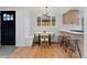 Cozy breakfast nook features a built-in bench and modern lighting at 3377 N Krameria St, Denver, CO 80207