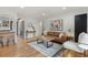 Open living room with wood floors, a patterned rug, and stylish furniture at 3377 N Krameria St, Denver, CO 80207