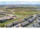Aerial view of community with a school and playground nearby at 16212 E Geddes Ln # 11, Aurora, CO 80016