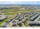 Aerial view of a community with a pool, pond, and tennis court at 16212 E Geddes Ln # 11, Aurora, CO 80016
