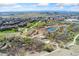 Scenic aerial view of the neighborhood with walking trails, lush green spaces and a pond at 16212 E Geddes Ln # 11, Aurora, CO 80016