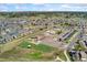 Aerial view of community with a school, sports fields, and playground at 16212 E Geddes Ln # 11, Aurora, CO 80016