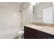 Bathroom featuring a dark wood vanity with a granite countertop and a shower and tub combo at 16212 E Geddes Ln # 11, Aurora, CO 80016