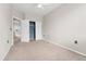 Spacious bedroom with closet and doorway, neutral walls and carpet at 16212 E Geddes Ln # 11, Aurora, CO 80016