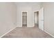 Spacious bedroom with closet and doorway, neutral walls and carpet at 16212 E Geddes Ln # 11, Aurora, CO 80016