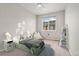 staged bedroom features neutral walls and carpet with a large window at 16212 E Geddes Ln # 11, Aurora, CO 80016