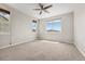 Bright bedroom with neutral walls, carpet, ceiling fan and windows with great natural light at 16212 E Geddes Ln # 11, Aurora, CO 80016