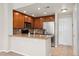 Well-equipped kitchen with granite countertops, stainless steel appliances, and wood cabinets at 16212 E Geddes Ln # 11, Aurora, CO 80016
