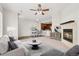 Comfortable living space featuring stylish furnishings, a cozy fireplace, and a seamless flow to the dining area and kitchen at 16212 E Geddes Ln # 11, Aurora, CO 80016