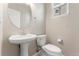 Neat half bathroom offering a pedestal sink and modern fixtures for guests at 16212 E Geddes Ln # 11, Aurora, CO 80016