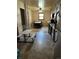 Functional kitchen and dining area with tile floors, wood cabinets and a small table at 7488 Quivas St, Denver, CO 80221