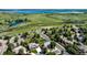A quiet residential street with mature trees, well-maintained homes, and manicured lawns at 10293 E Sheri Ln, Englewood, CO 80111